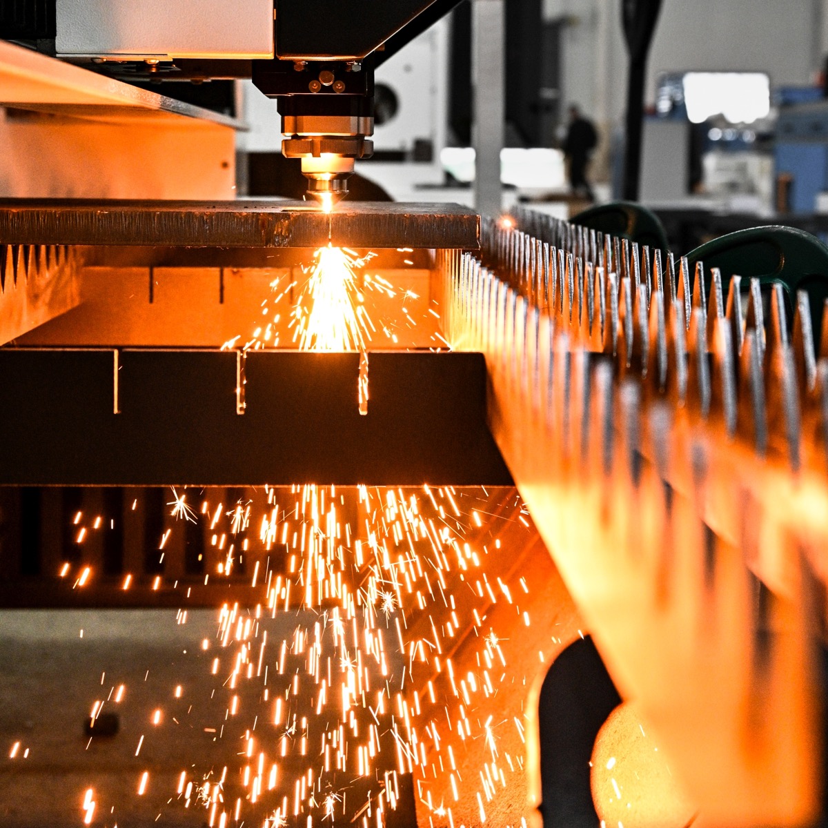 Laser cutting sparks in an industrial workshop